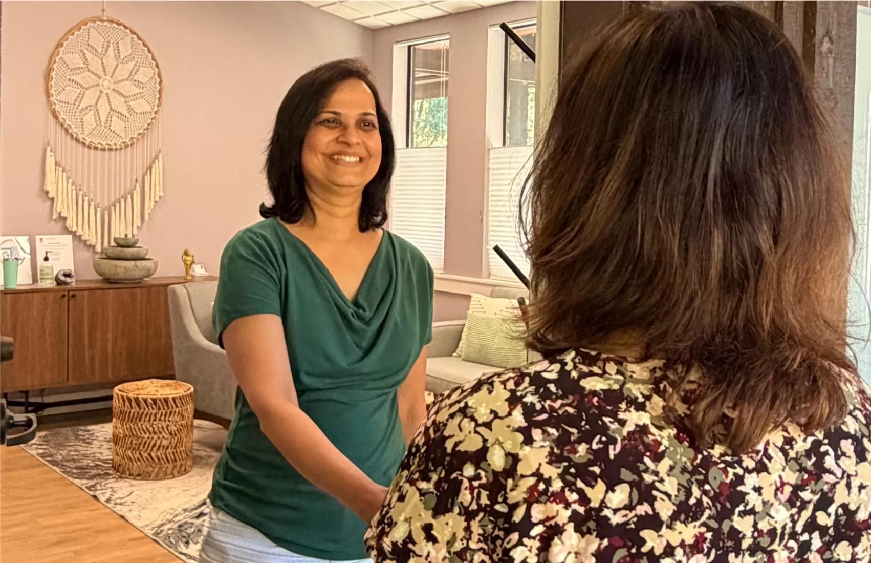 Dr. Malathi Acharya greeting a patient at Ayur Integrative Medicine